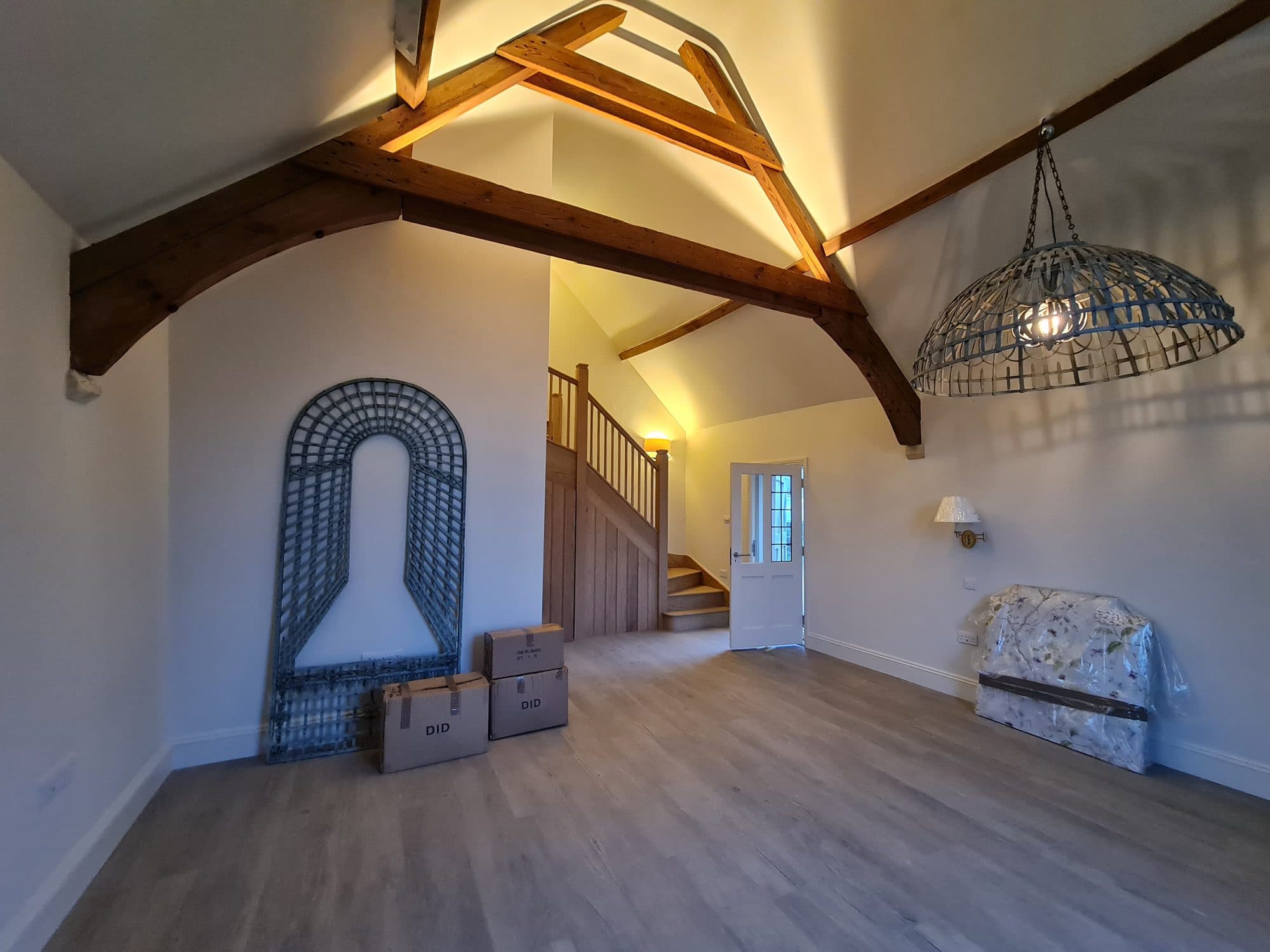 The main room beneath the roof timbers, lit from above