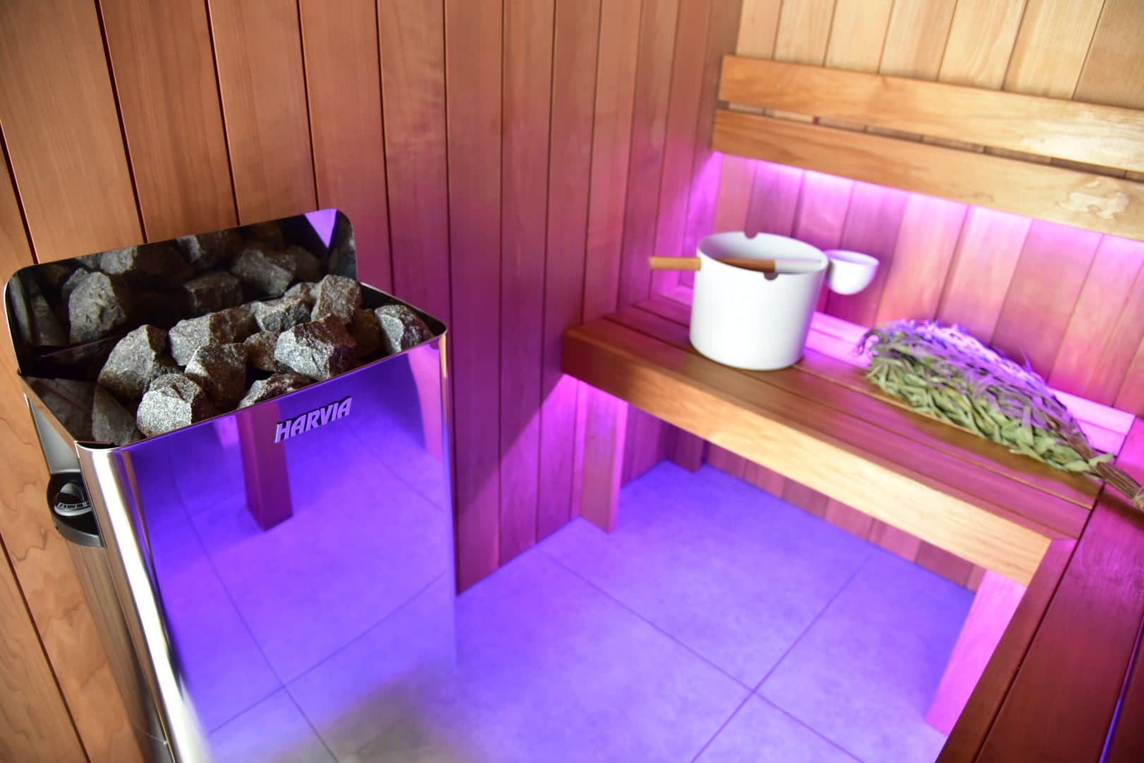 The heater and its stones beside the lower bench